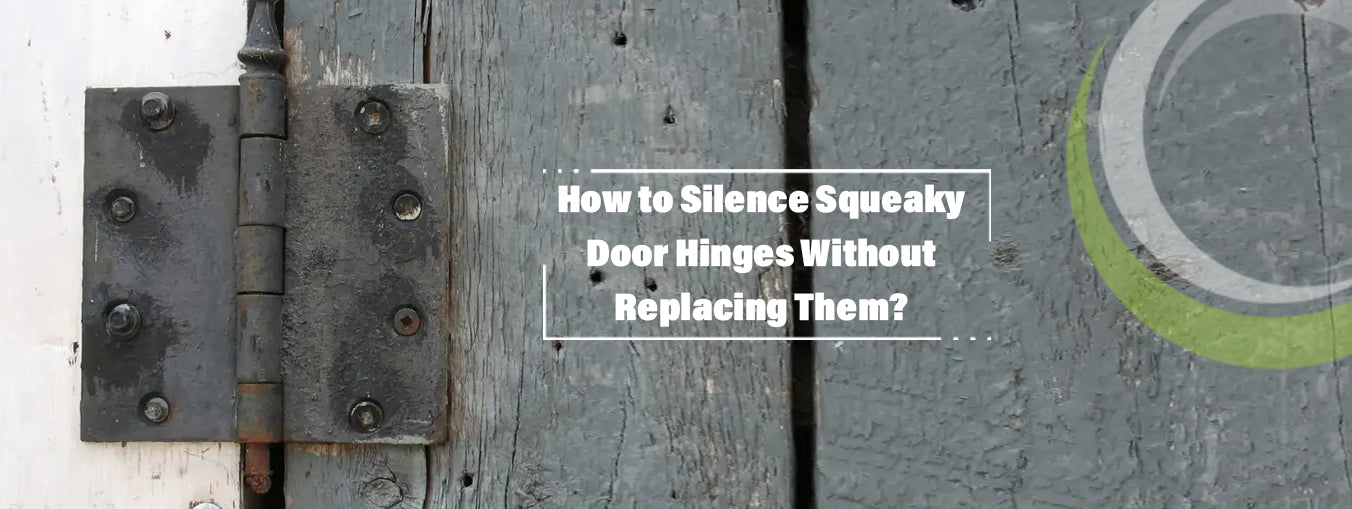 Black metal door hinge on weathered gray wood door.